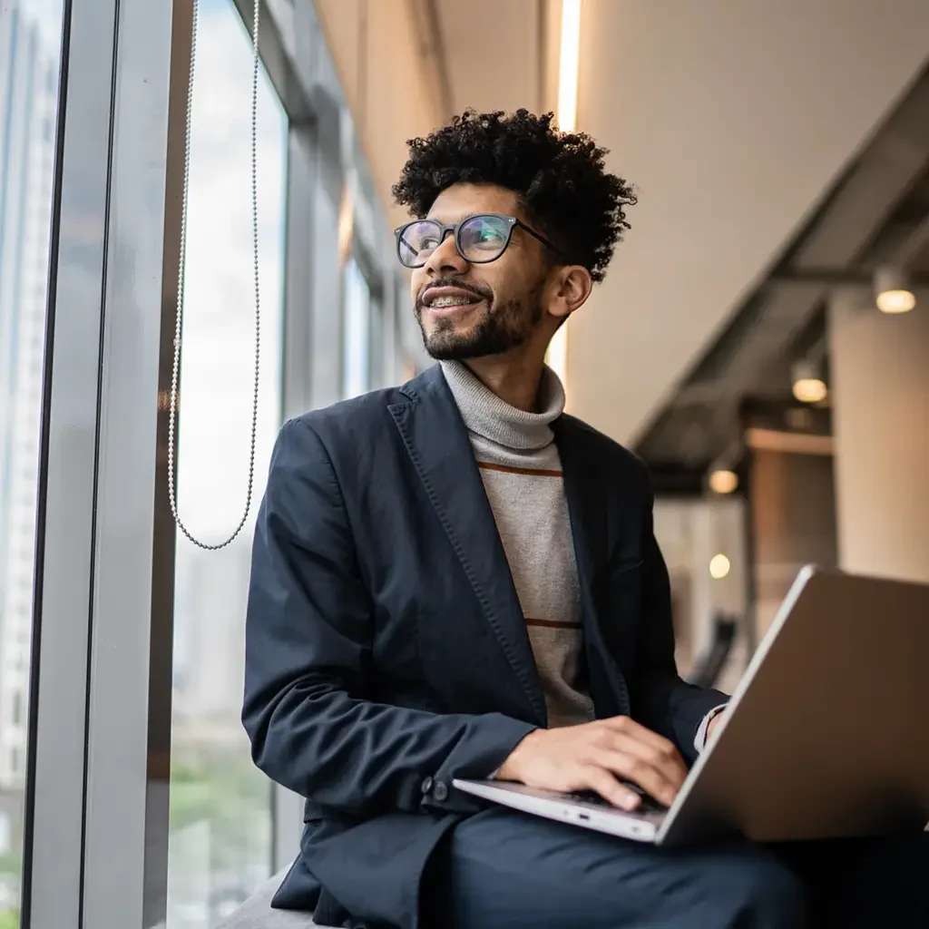 Man sitting looking out a window